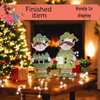 a couple of christmas decorations sitting on top of a table