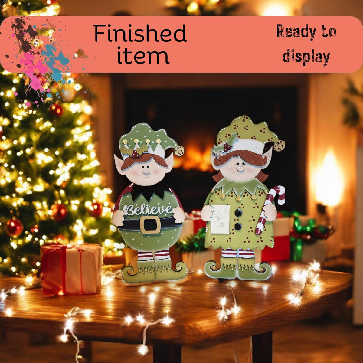 a couple of christmas decorations sitting on top of a table