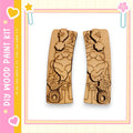 two wooden cutouts of a gnome holding a camera, set against a pink and yellow background with decorative elements.