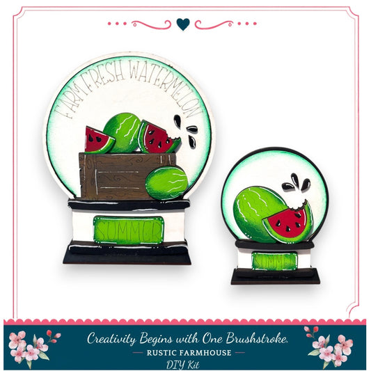 two decorative items with a watermelon theme. The larger item is a decorative plate with a watermelon design and the word "FRESH WATERMELON" written on it. The smaller item is a decorative bowl with a watermelon design and the word "SUMMER" written on it. Both items are placed on a white background, and the image includes text that reads "Creativity Begins with One Brushstroke - RUSTIC FARMHOUSE - DIY KIT".