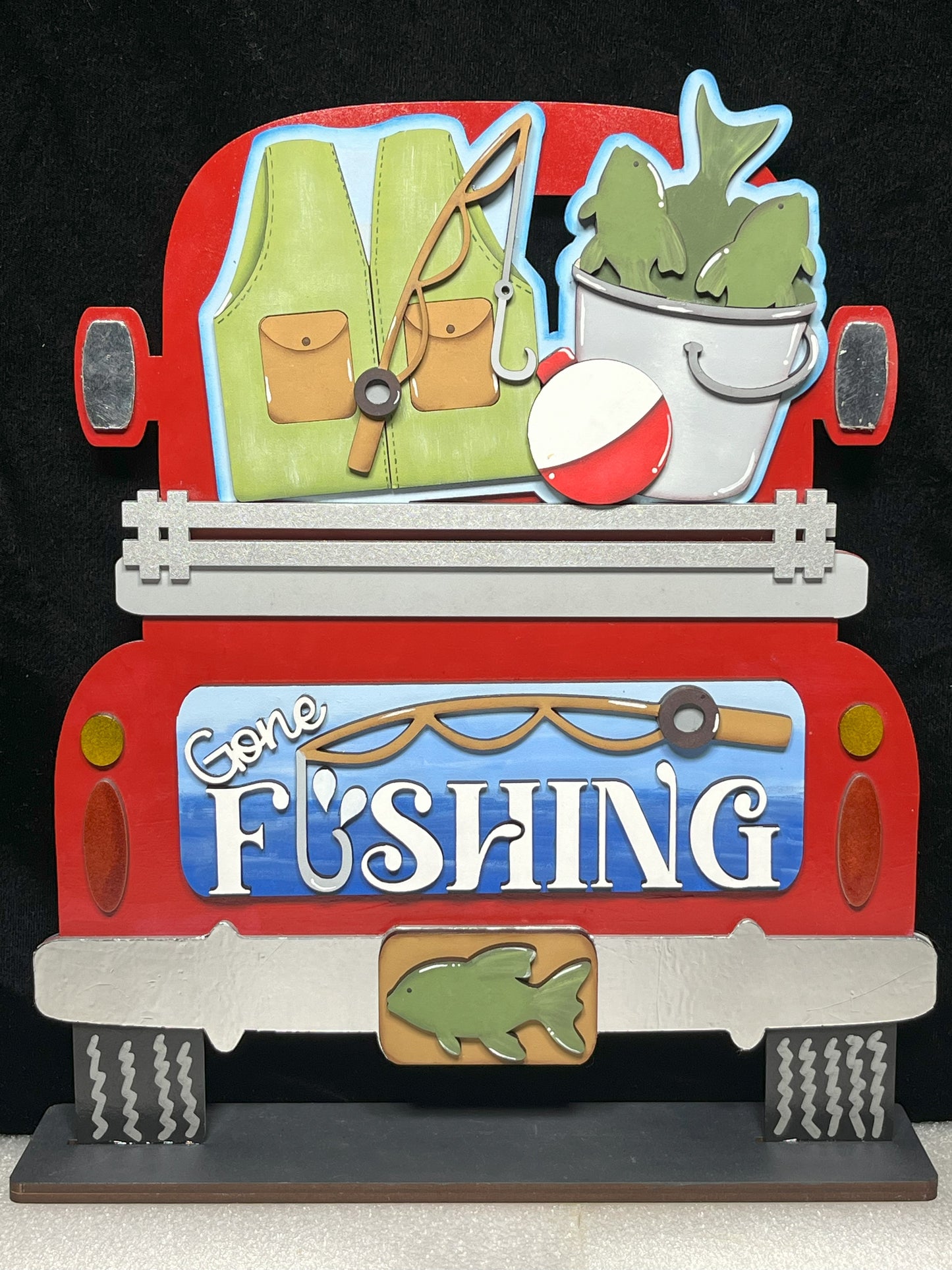 a picture of a truck with a fishing theme