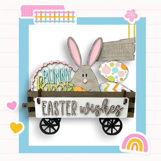 an easter card with a bunny in a wagon