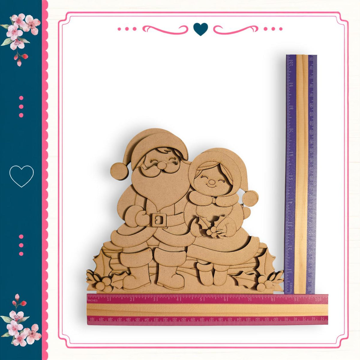 A wooden Santa Claus and Little Girl figure, likely made of cardboard, is depicted in the center of the image. The figure is surrounded by a decorative border, and a ruler is placed next to it, indicating a size reference.