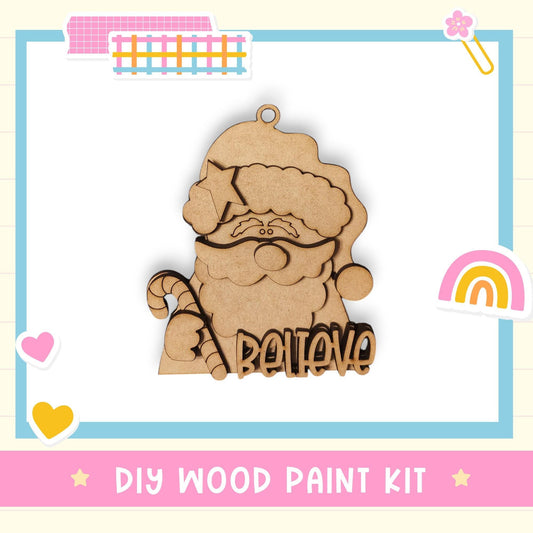 a DIY wood paint kit for creating a wooden ornament, with a wooden Santa Claus figure as the main design element.