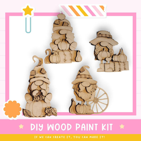 The image is a promotional poster for a DIY wood paint kit, featuring four wooden gnome figurines in various poses and accessories, such as hats and pumpkins.