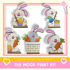 The image is a collage of five wooden Easter bunny figures, each holding a carrot and placed in a basket. The text below the image reads "DIY WOOD PAINT KIT" and "If we can create it, you can make it!"