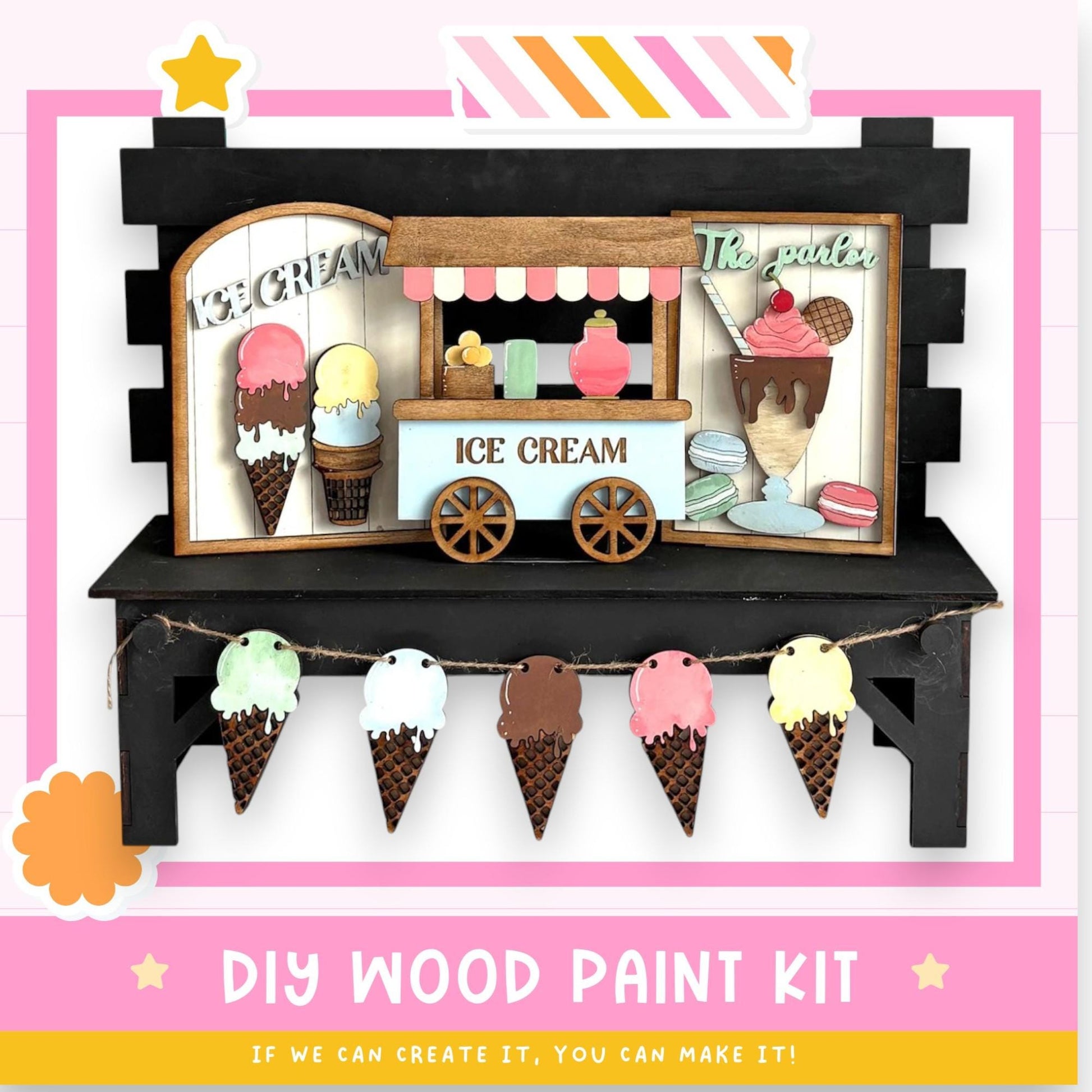 The image is a colorful and whimsical depiction of an ice cream shop, featuring a wooden ice cream stand with various ice cream flavors and toppings. The shop is decorated with paper cutouts of ice cream cones and scoops, creating a playful and inviting atmosphere. The image also includes a DIY wood paint kit, suggesting that the viewer can create their own ice cream shop scene.
