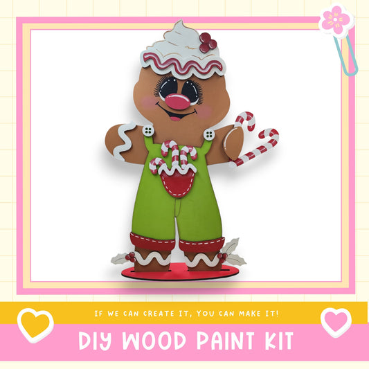 a picture of a gingerbread man with candy canes