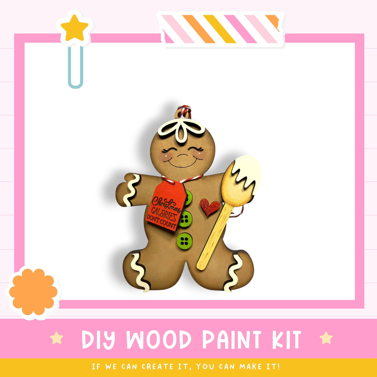 A wooden gingerbread man figure with a red tag that says "Christmas Donuts" and a heart-shaped button on its chest, set against a pink and white background.
