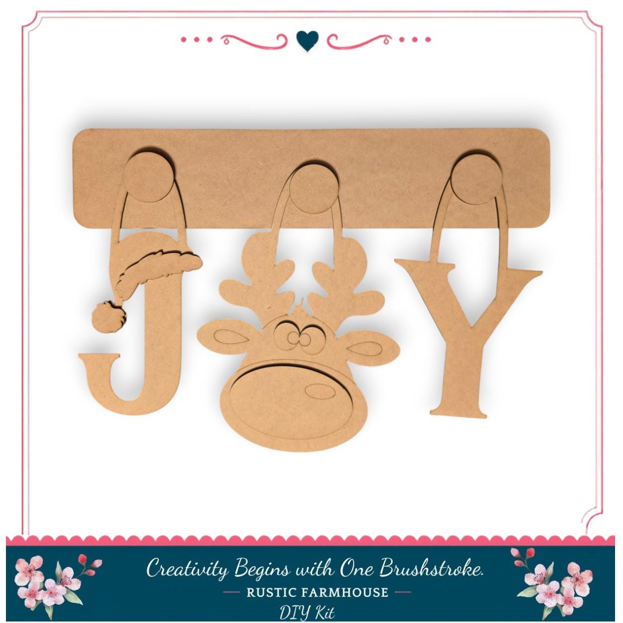 A DIY kit for creating wooden ornaments, including a jester hat, a reindeer, and a letter "Y".