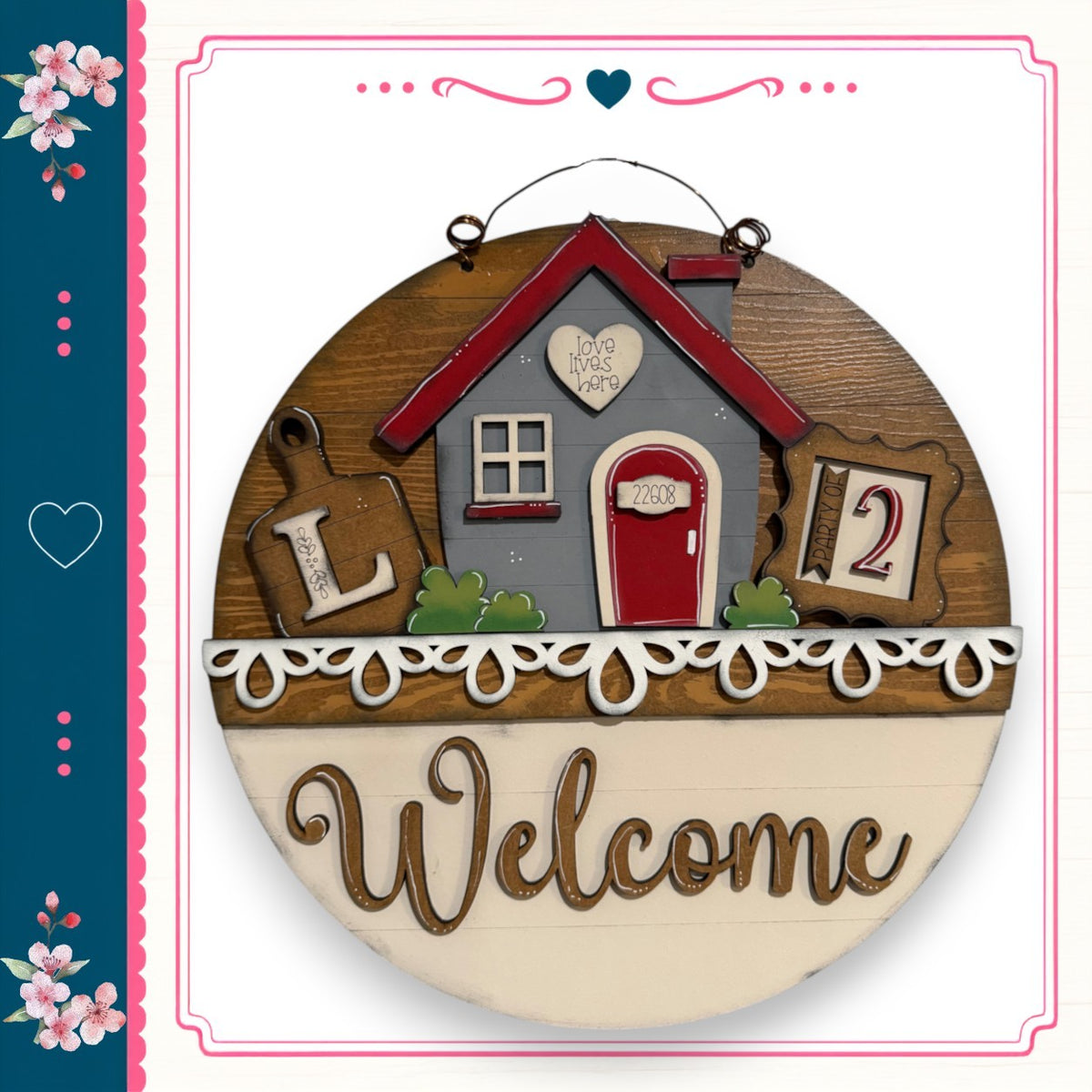 A wooden sign with a house and the word "Welcome" written on it.