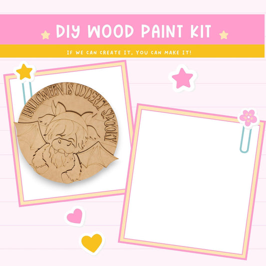 The image is a DIY wood paint kit with a Halloween-themed design, featuring a wooden bat and a wooden monster. The kit appears to be a creative project that can be made with the provided materials.