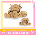 a wooden cutout of a girl holding a gun