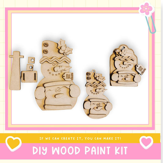 a DIY wood paint kit, including a snowman, a snowman with a hat, and a snowman with a scarf. The kit appears to be made of wood and is designed for creating wooden figures.