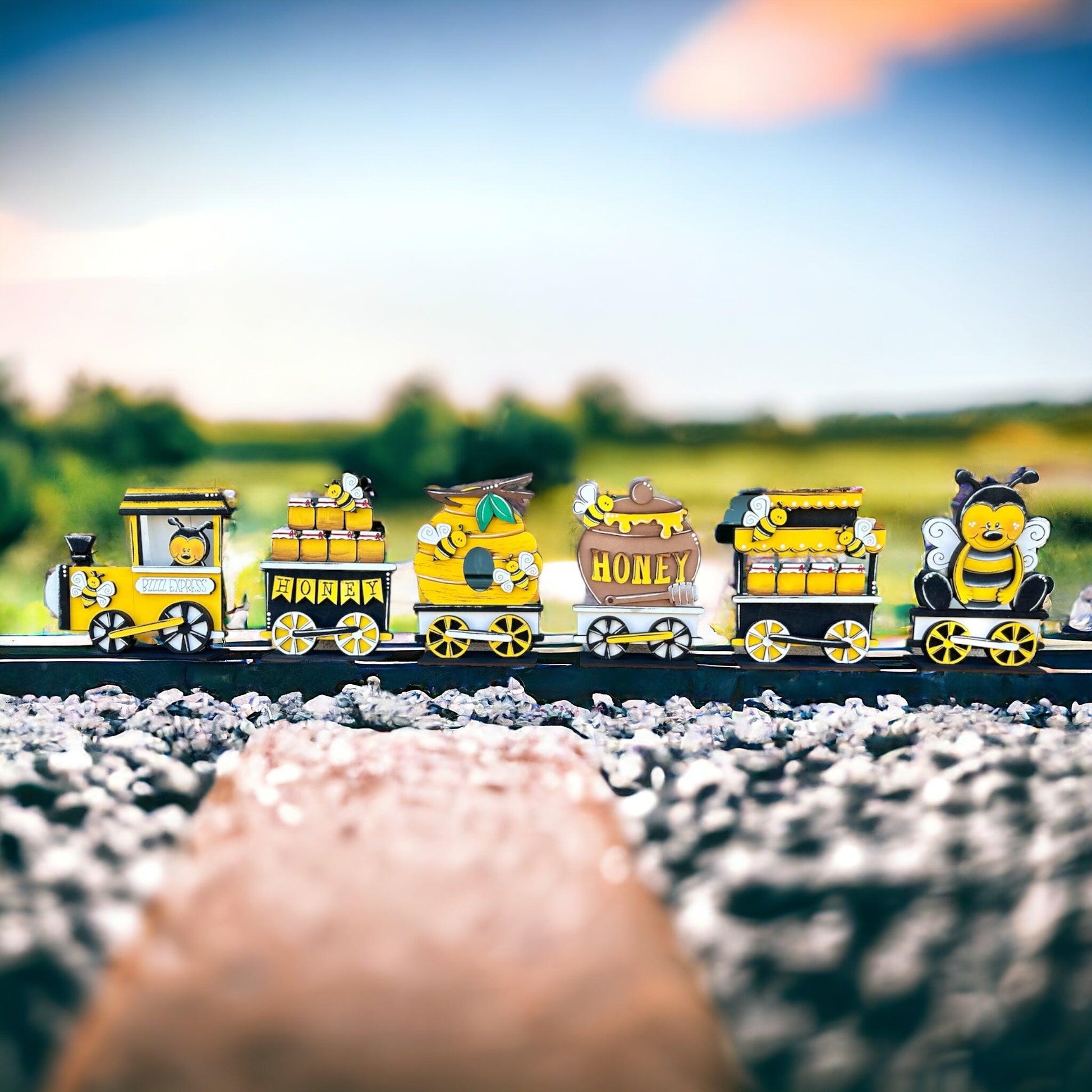 a yellow and black train traveling down train tracks