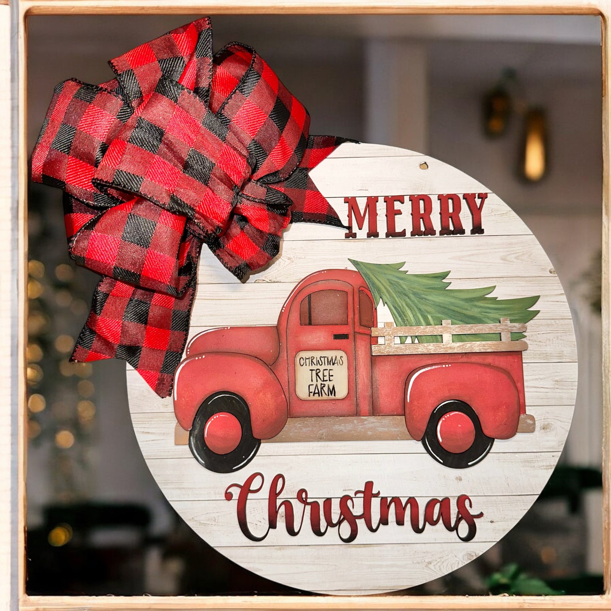 a red truck with a christmas tree on the back of it