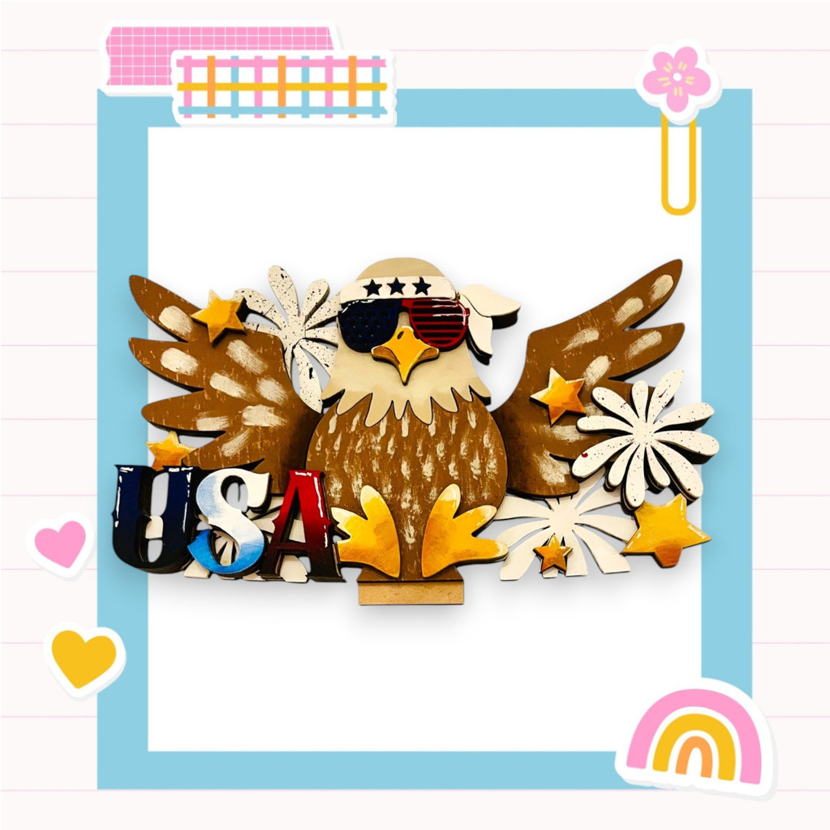 A wooden eagle wearing sunglasses and surrounded by various patriotic symbols, including stars, flowers, and the word "USA", all set against a colorful background.