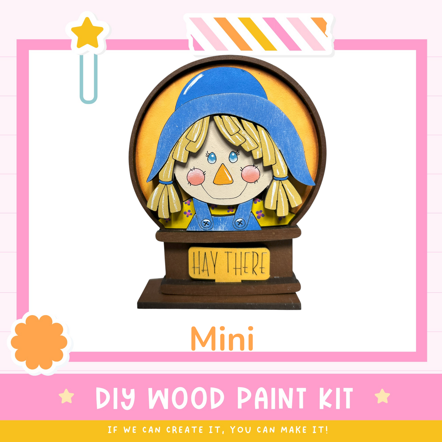 a DIY wood paint kit for creating a Mini scarecrow, with a colorful illustration of a scarecrow and the text "HAY THERE!"