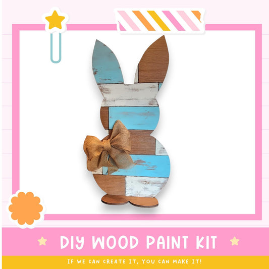 a wooden bunny with a bow on it's head