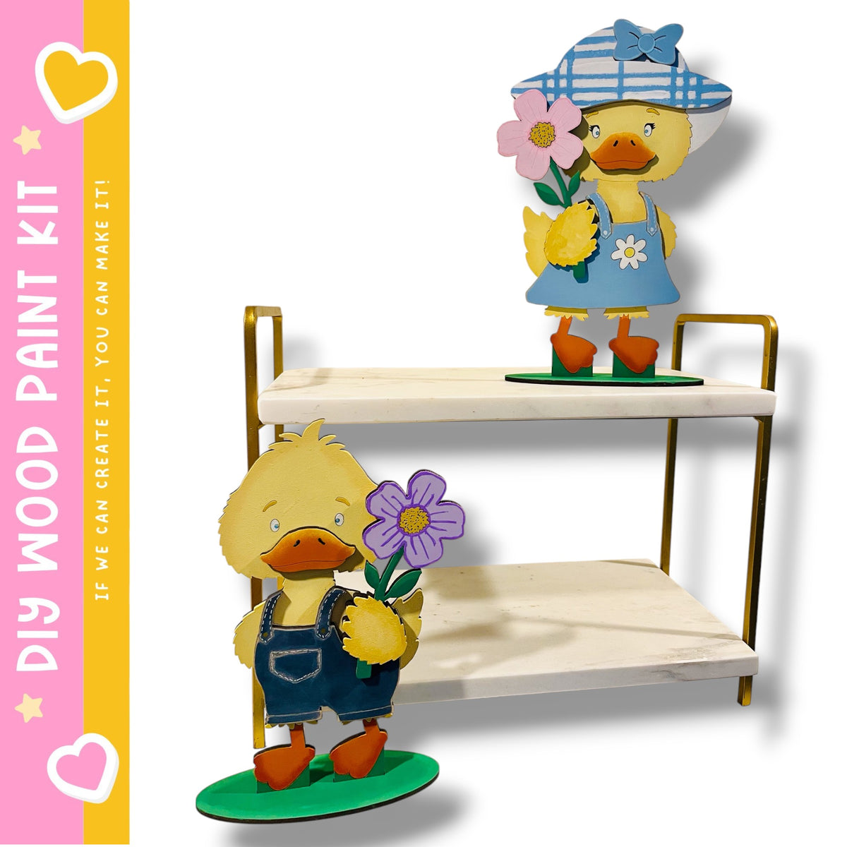 two wooden toy duck figures, one standing on a green platform and holding a purple flower, and the other standing on a white platform and holding a pink flower.