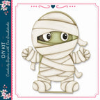 A cartoon image of a wrapped-up figure with large eyes and a mischievous expression, set against a white background.