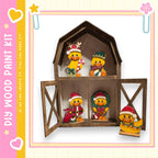 A wooden barn-shaped display case containing various small figurines, including ducks and other animals, dressed in festive holiday attire.