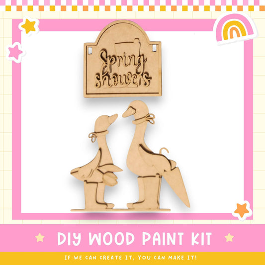 a wooden craft kit with a picture of a couple of birds