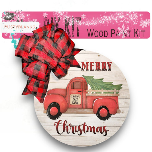 a wooden christmas ornament with a red truck