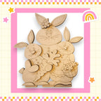 a wooden cutout of two rabbits holding a basket of flowers