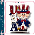 A wooden figure of a man wearing a hat with stars and stripes, standing next to the letters "USA" in a decorative arrangement.