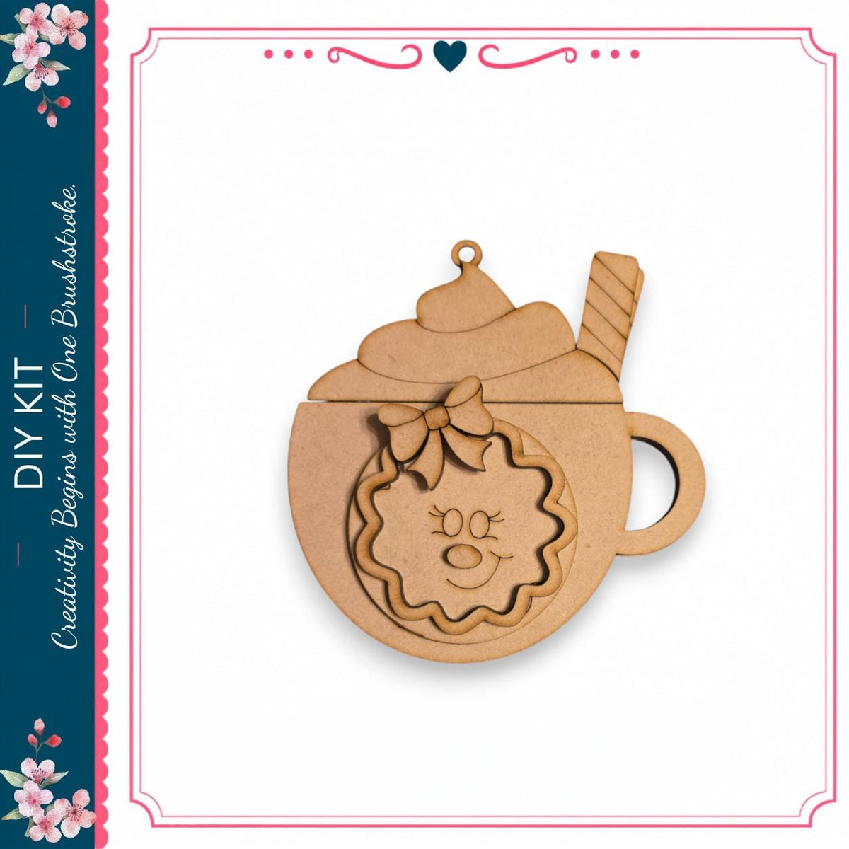A wooden ornament in the shape of a cup with a smiley face and a wreath on top, sitting on a white background.
