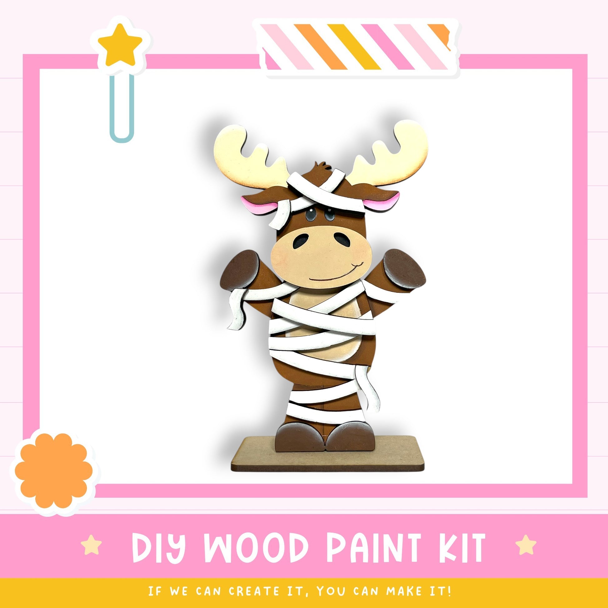 a wooden toy moose with antlers, wrapped in white cloth, and standing on a wooden base. The image is part of a DIY wood paint kit, and it is described as a kit for creating a wooden toy moose.