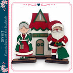 Santa Claus and his reindeer standing in front of a small wooden house with a red roof and a sign that reads "Santa's Workshop".