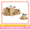 The image is a DIY wood paint kit featuring a wooden bee and flower decoration.