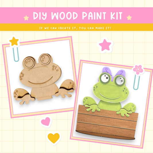 a wooden cutout of a frog sitting on top of a piece of wood