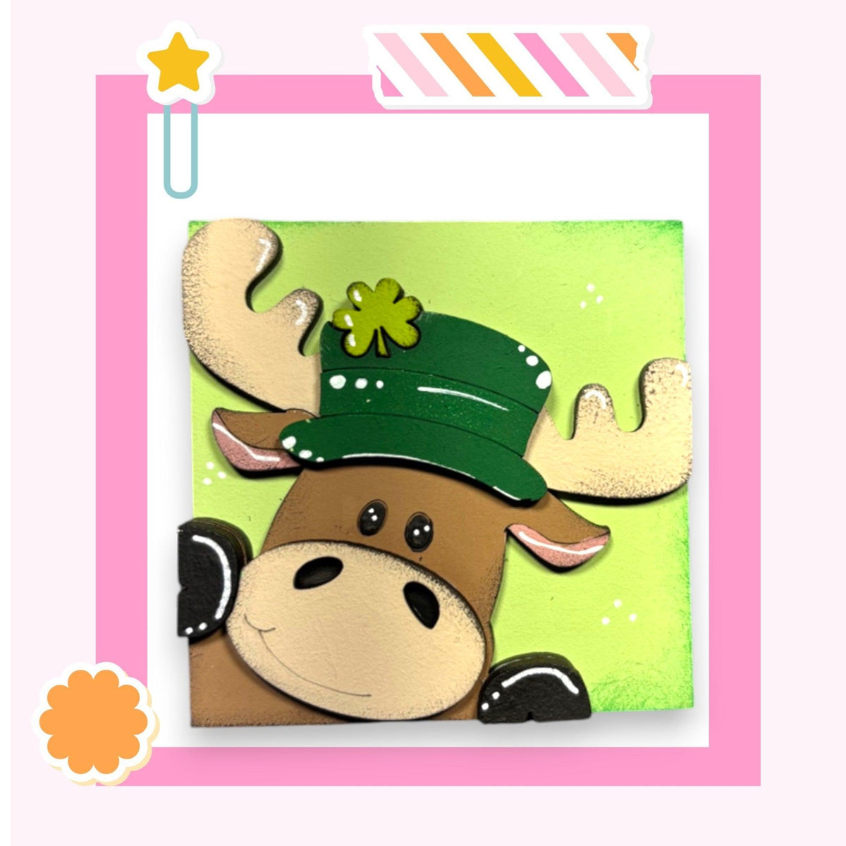 a card with a picture of a moose wearing a green hat