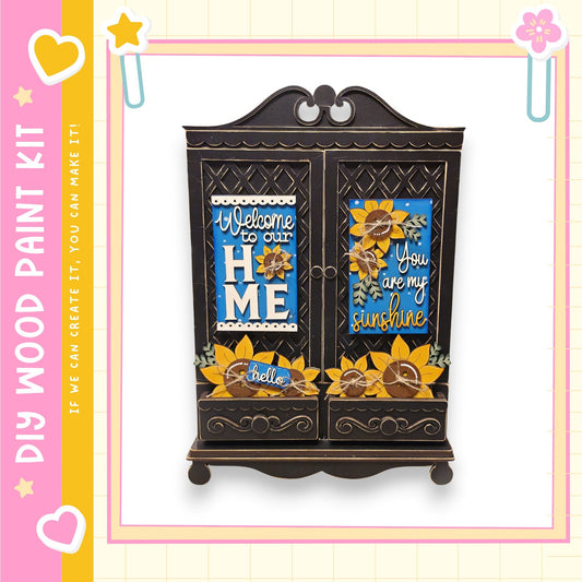 A wooden cabinet with decorative elements, including a sign that says "Welcome to our home" and another that says "You are my sunshine".