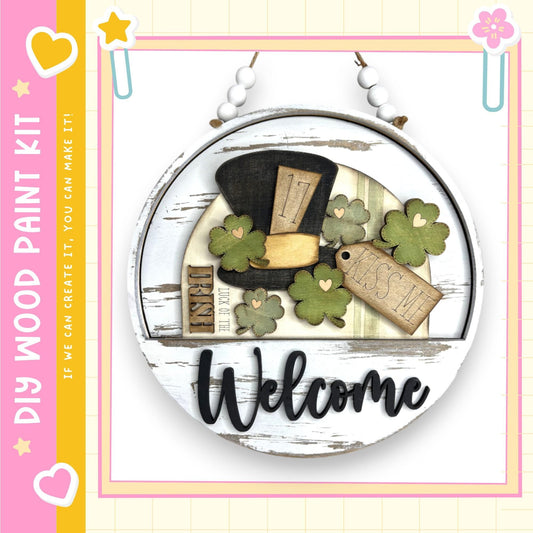 A wooden sign with a welcome message, surrounded by various decorative elements such as clovers and a star.