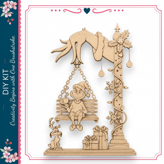 A wooden swing with a person and a dog on it, along with a gift box and other decorative elements.
