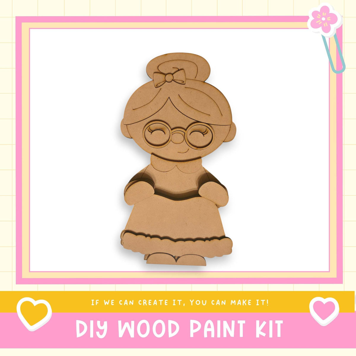 a DIY wood paint kit, with a wooden doll or character in the center. The kit is presented in a pink and yellow frame, and the text "If we can create it, you can make it!" is displayed below the image.
