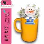 a yellow mug with a snowman in it