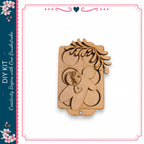 a wooden gingerbread house kit with a decorative leaf design.