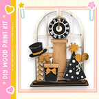 The image is a wooden clock display with various decorative elements, including a clock, a hat, a gift box, and a balloon.