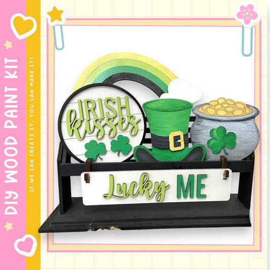 a DIY paint kit for creating a Lucky Me sign, which includes Irish kissing, a pot of gold coins, and a leprechaun hat.