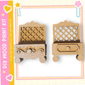 two wooden drawers or shelves, each with a unique design and shape, set against a pink and yellow background.