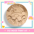 a wooden plate with a cartoon character on it