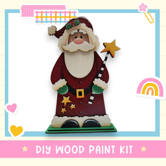 A wooden Santa Claus figure with a star on a stick, surrounded by various colorful and whimsical elements such as hearts, rainbows, and stars.