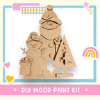 a DIY wood paint kit for creating a snowman and a Christmas tree, with various decorative elements surrounding the kit.