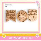 three wooden cutouts with text and designs related to summer and watermelon, along with a DIY wood paint kit and a heart-shaped logo.