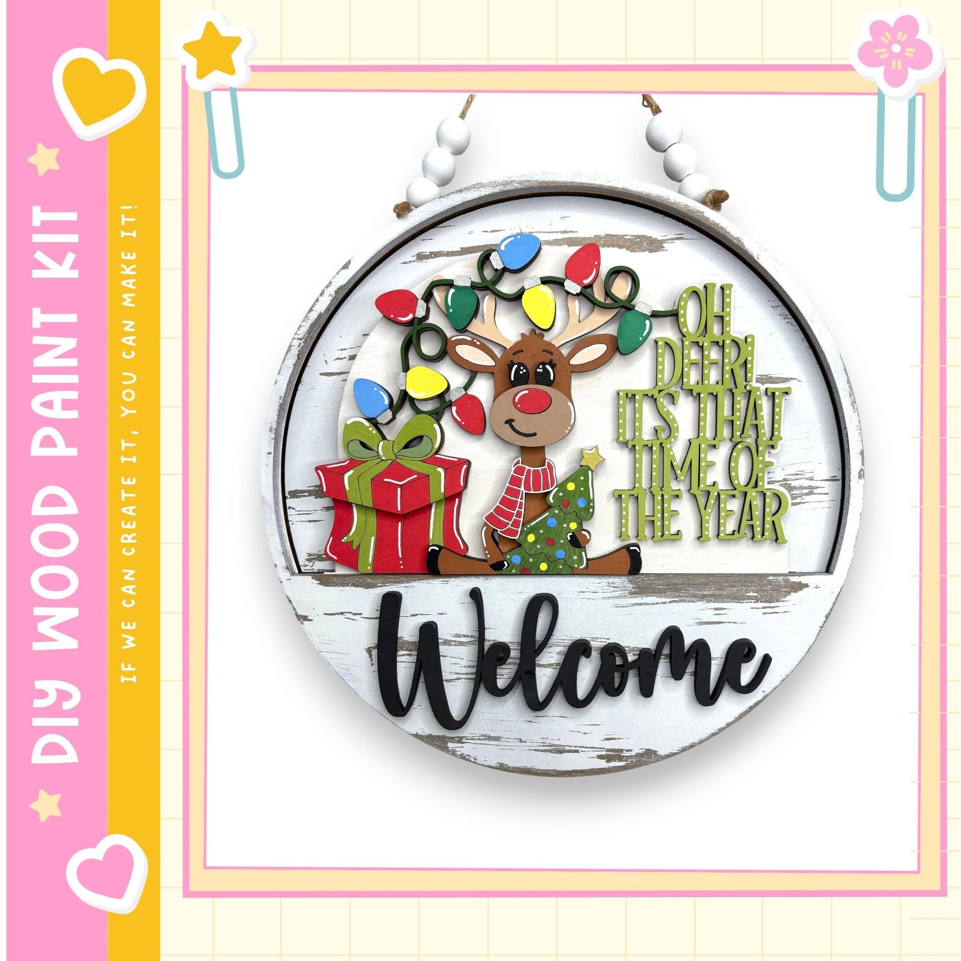 A wooden sign with a festive Christmas theme, featuring a reindeer, a gift, and the text "Welcome" in a cheerful holiday style.